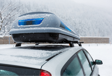 Roof rack attached to the roof of a snowy car